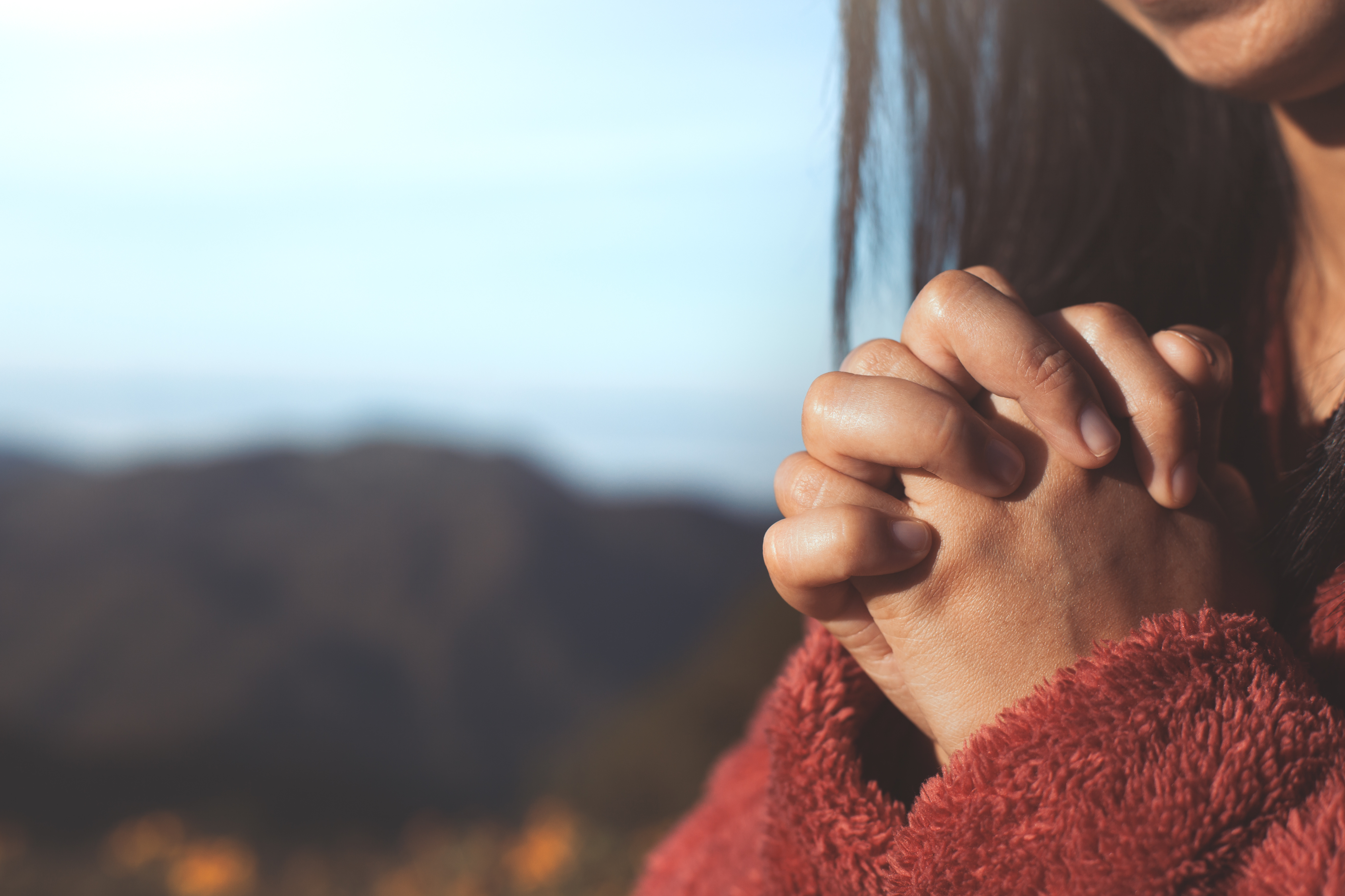Woman hands folded in prayer in beautiful nature background with sunlight  in vintage color tone | Help Club for Moms